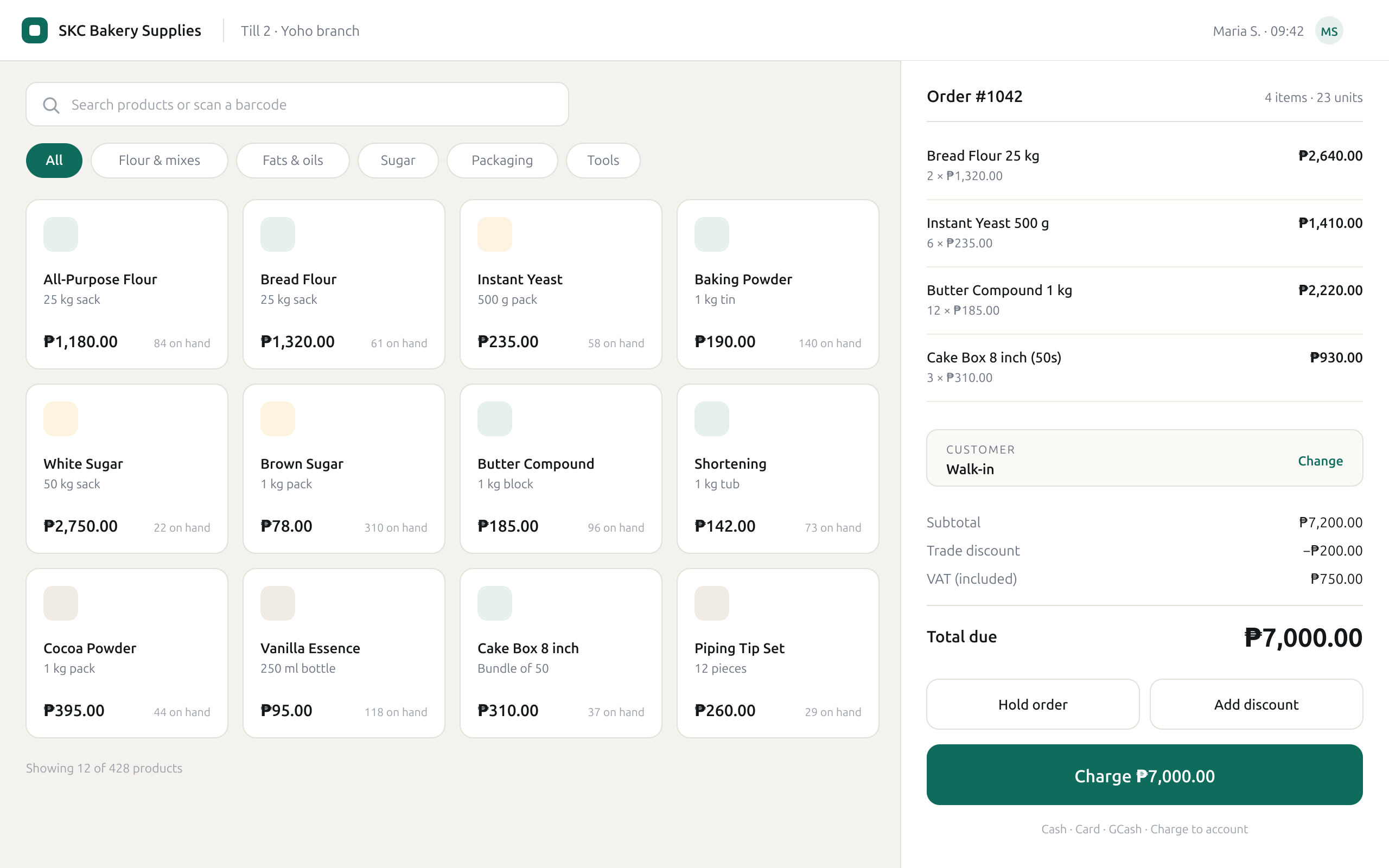 The till screen: a searchable product grid on the left, the current order, discounts and total on the right.